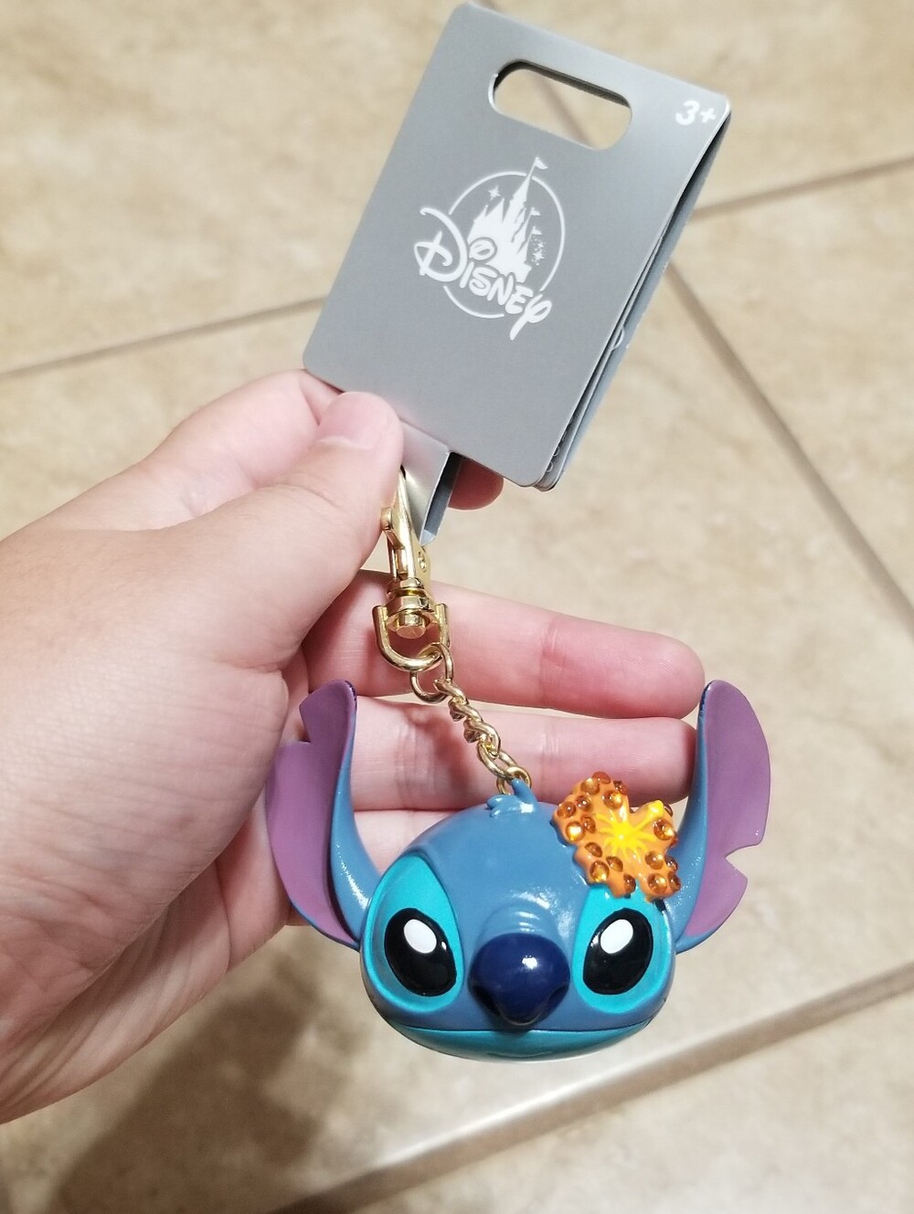 New with tags Disney Stitch With Hibiscus Flower Bag Charm.  Measures about 1.75